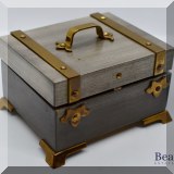 D22. Swiza clock in a trunk. 3” x 2” - $60 